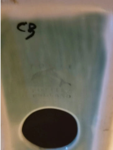Underside and Poole Pottery England factory mark with handwritten CB initials on the green Springbok bookend
