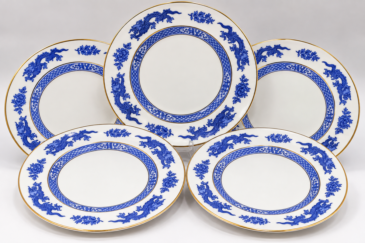 Five white ceramic serving plates with blue floral and dragon motifs and gold rims, arranged on a light gray background.