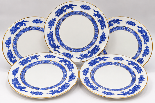 Five white ceramic serving plates with blue floral and dragon motifs and gold rims, arranged on a light gray background.