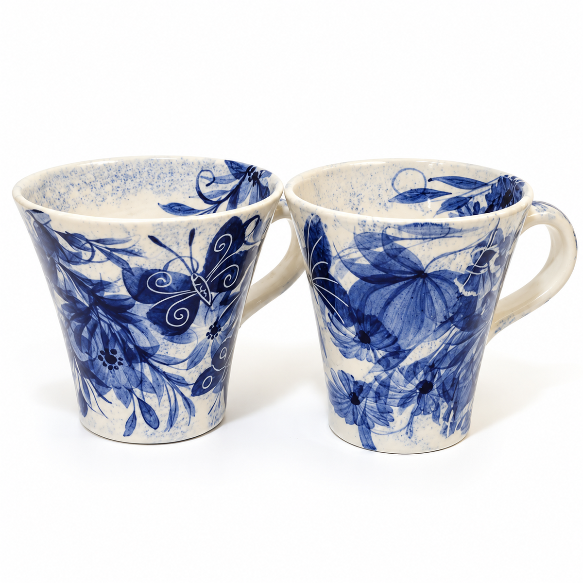 Pair of Gwili Pottery hand-thrown Welsh studio pottery mugs with cobalt blue floral and butterfly decoration